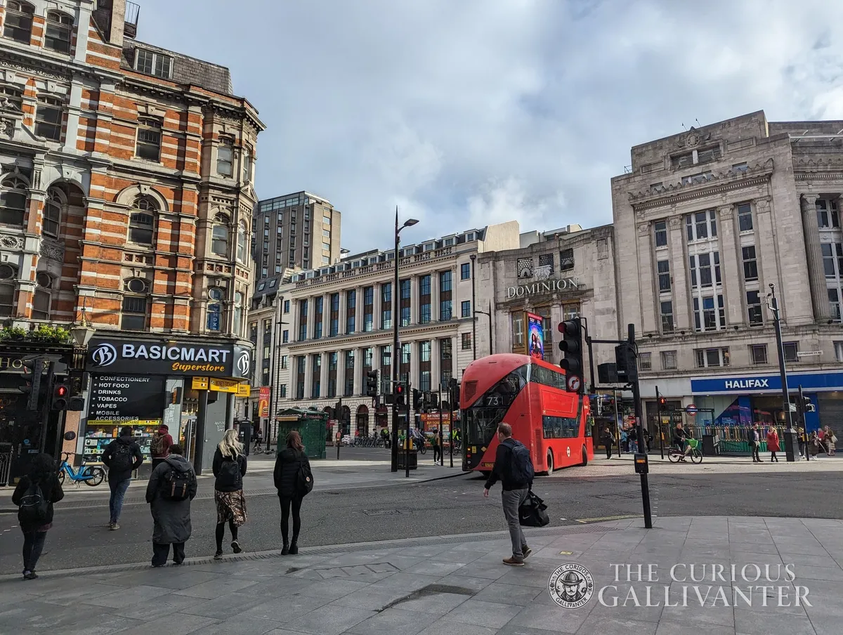 Out of the Elizabeth line and onto the street at the intersection of Tottenham Court Road and New Oxford Street in London